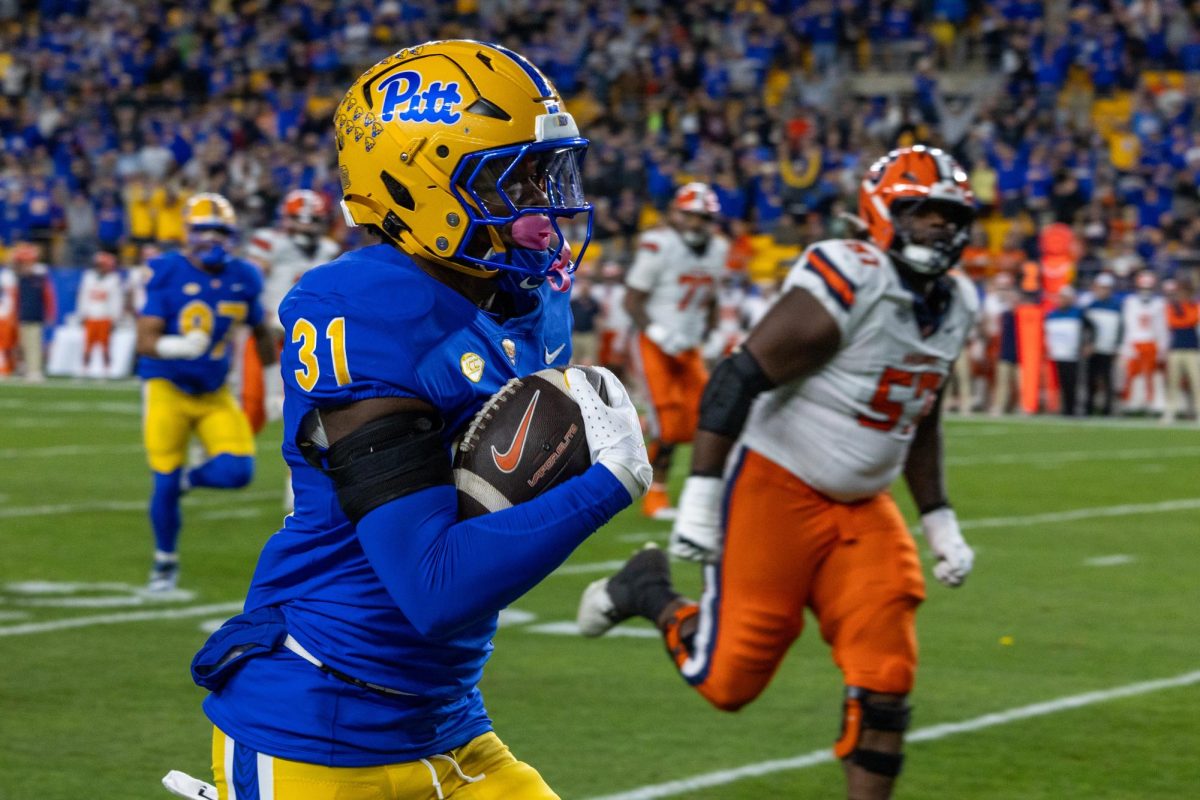 Pitt sophomore linebacker Rasheed Biles (31) runs with the ball at the football game against Syracuse in Acrisure Stadium on Thursday, Oct. 24.