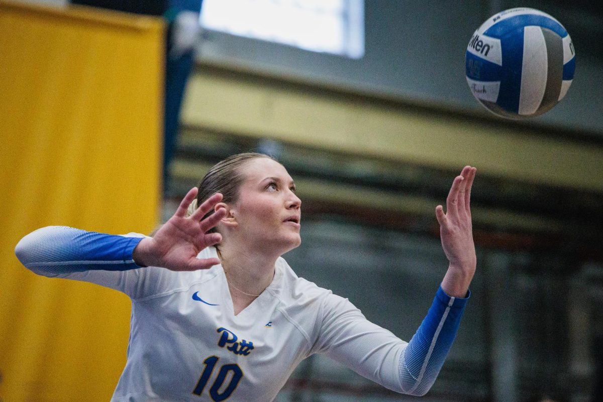 Senior setter Rachel Fairbanks (10) sets the ball during Saturday night’s game against Ohio State in the Fitzgerald Field House.