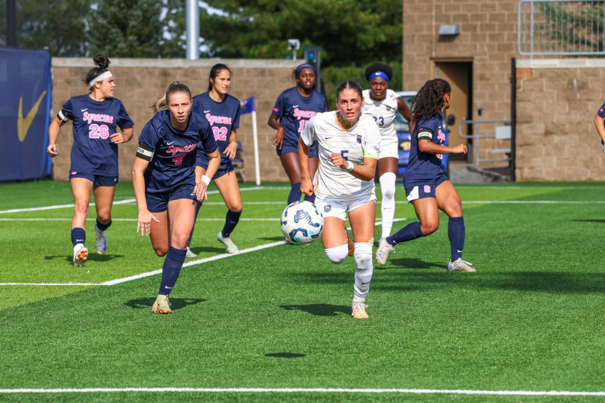 Senior forward Sarah Schupansky (5) charges for the ball at the soccer game against Syracuse at Ambrose Urbanic Field on Sunday. 