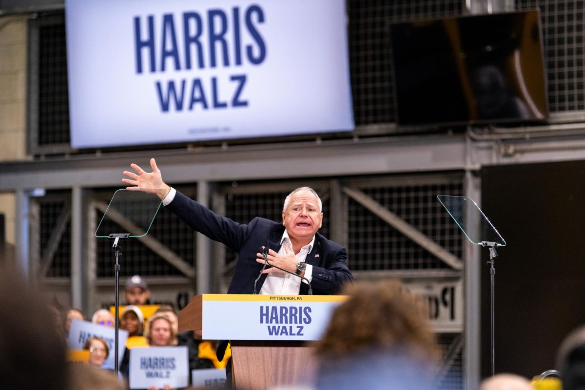 Minnesota governor and vice presidential candidate Tim Walz speaks to the crowd on Tuesday at Acrisure Stadium.