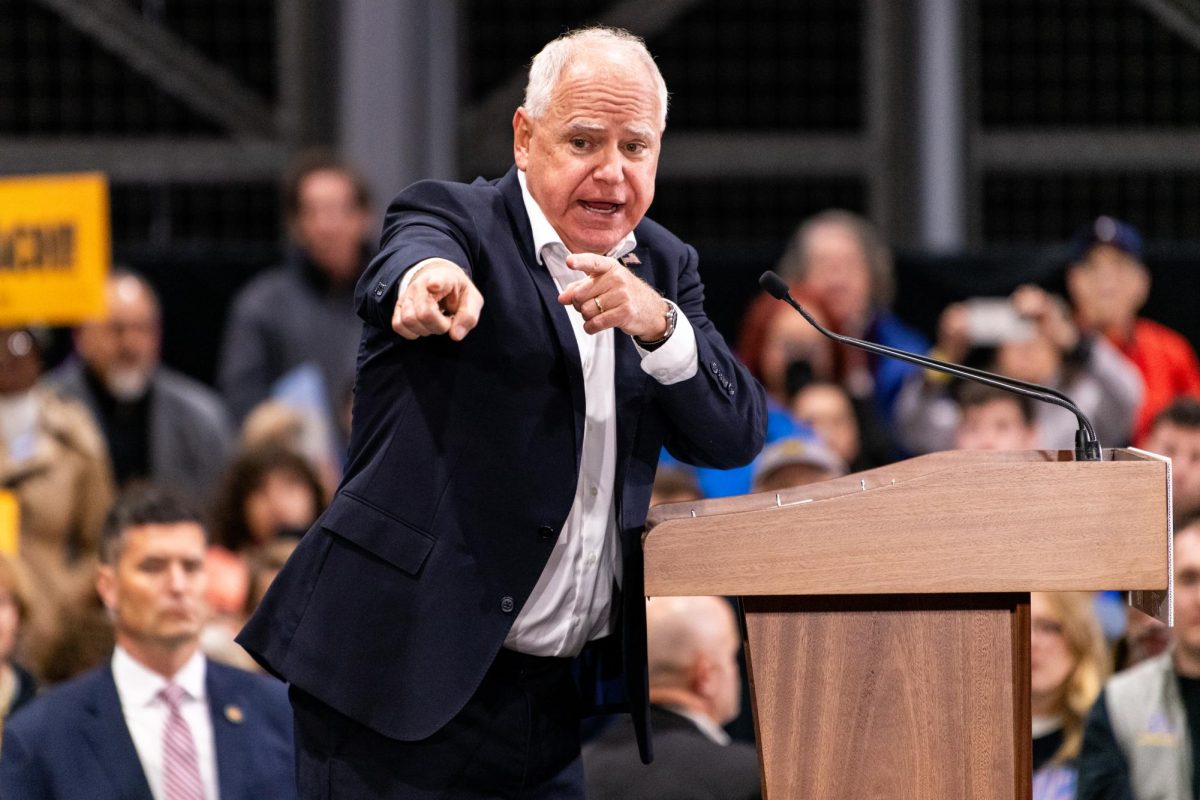 Minnesota governor and vice presidential candidate Tim Walz speaks to the crowd on Tuesday at Acrisure Stadium.