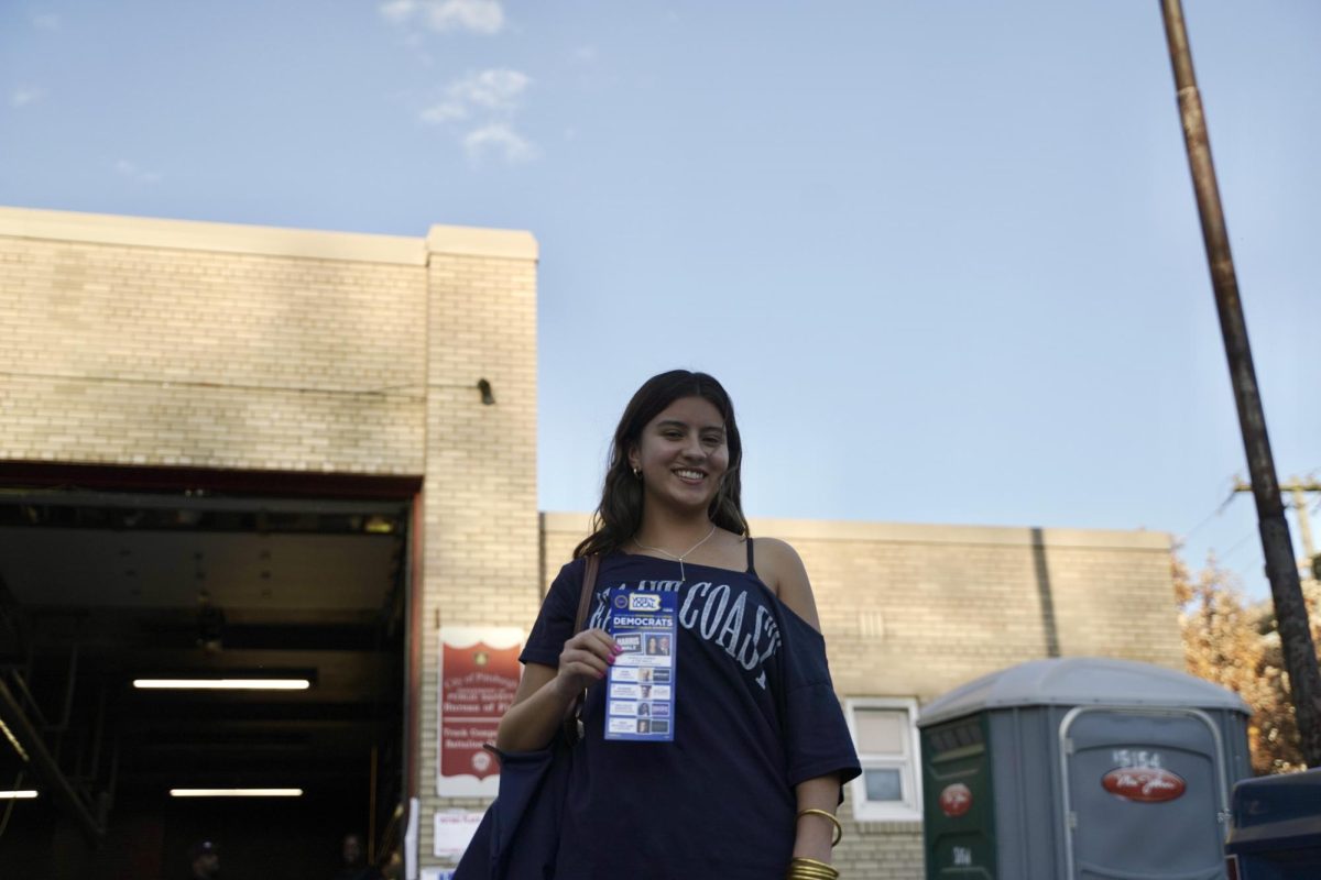 Amanda Alvarez, a freshman bioengineering student, smiles for a photo outside the Pittsburgh Fire Bureau Station 14 on Tuesday, Nov. 5. 