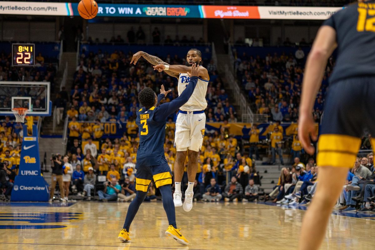 Graduate-student guard Damian Dunn (1) shoots the ball during the Pitt men's basketball game against West Virginia in the Petersen Events Center on Friday, Nov. 15.
