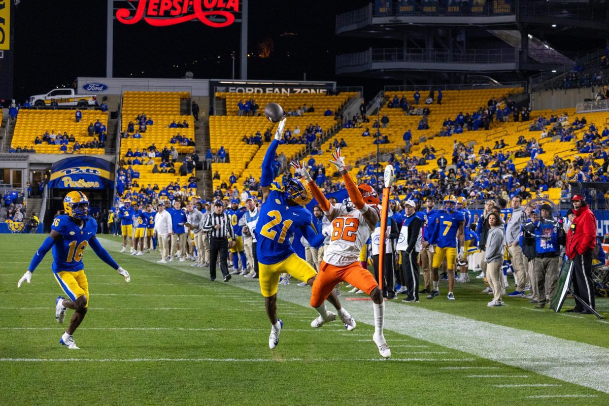 Redshirt first-year Shadarian Harrison (21) interferes with a pass to Syracuse at the football game in Acrisure Stadium on Thursday, Oct. 24.