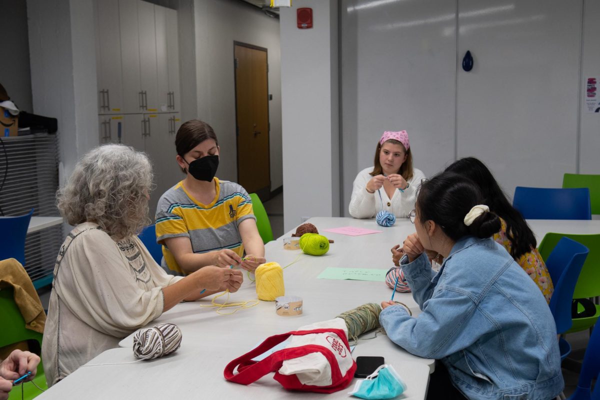 Attendees learn to crochet in the C4C at the Cathedral of Learning.