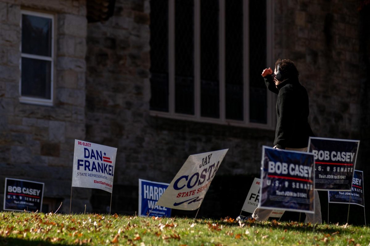 Political signs line the yard outside First Unitarian Church on Tuesday, Nov. 5.