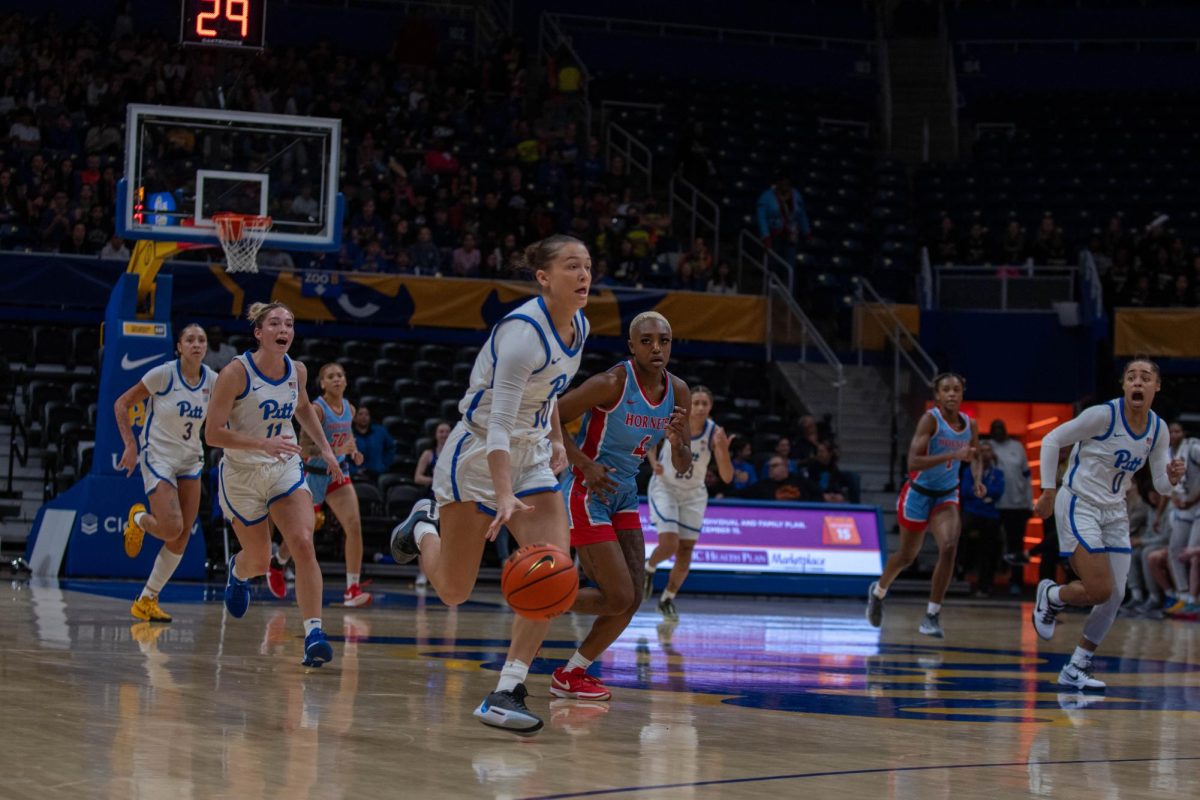 Senior guard Bella Perkins (10) drives the ball down the court during the basketball game against Delaware State in the Petersen Events Center on Wednesday, Nov. 20.
