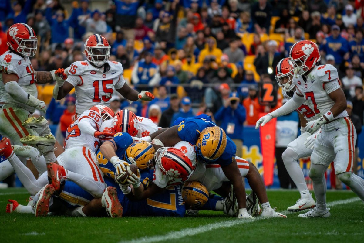 Clemson piles on top of Pitt football players during the game in Acrisure Stadium on Saturday, Nov. 16.