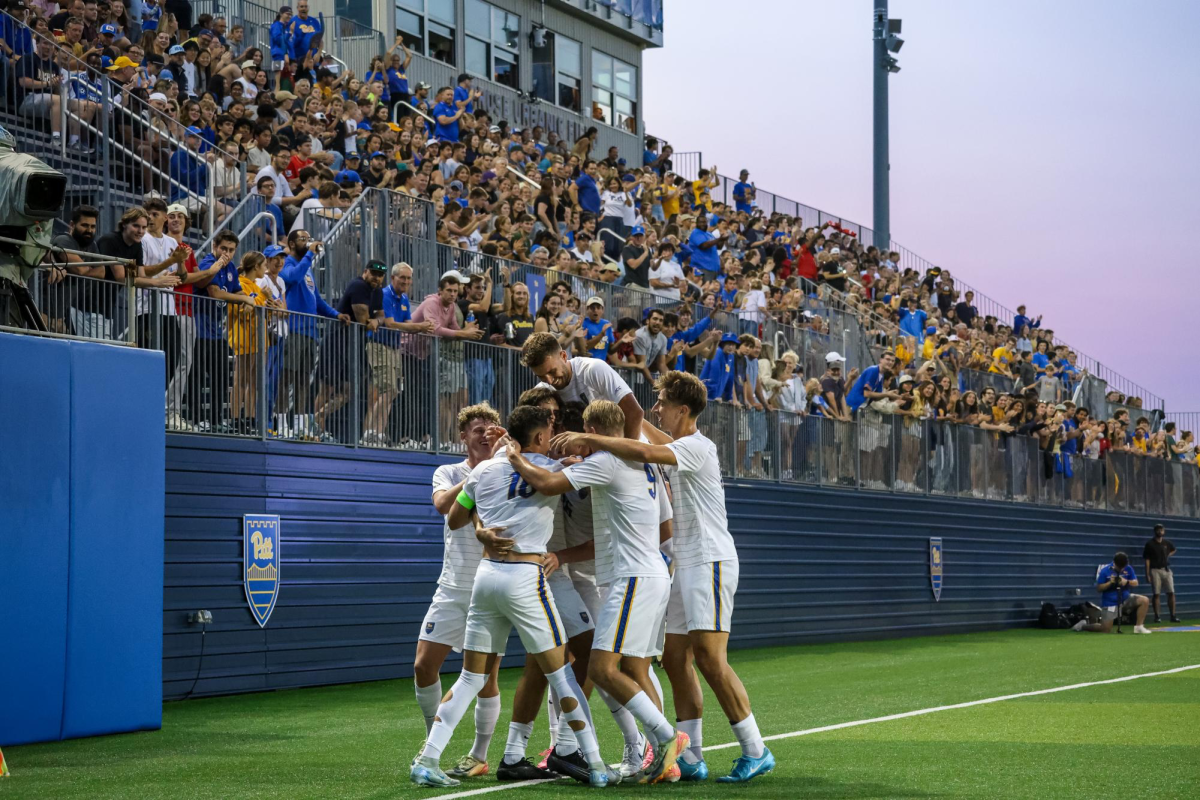 The Pitt men’s soccer team celebrates after a goal during Pitt men’s soccer’s game against Louisville at Ambrose Urbanic Field on Friday, Sept. 12.
