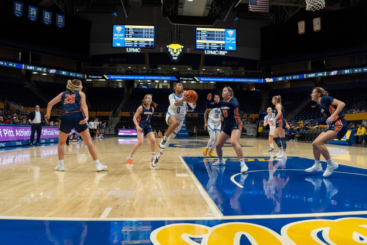 Senior guard Brooklynn Miles (0) lunges for the hoop during the basketball game against Bucknell in the Petersen Events Center on Saturday, Nov. 9.
