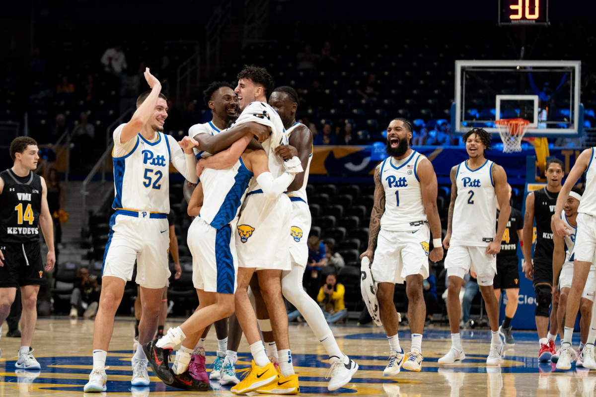 The Pitt men's basketball team celebrates during its game against VMI at the Petersen Events Center on Monday, Nov. 18
