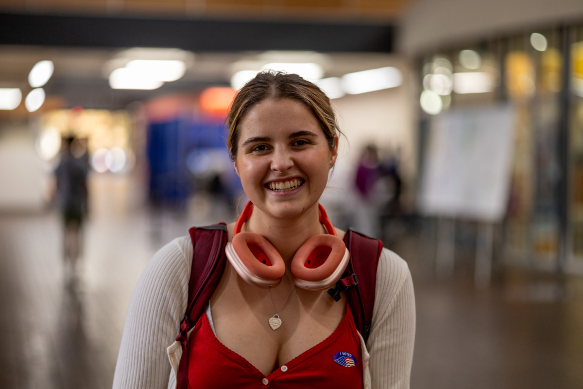 Kate Carpenter, a junior psychology student, smiles for a photo in Posvar Hall on Tuesday, Nov. 5.