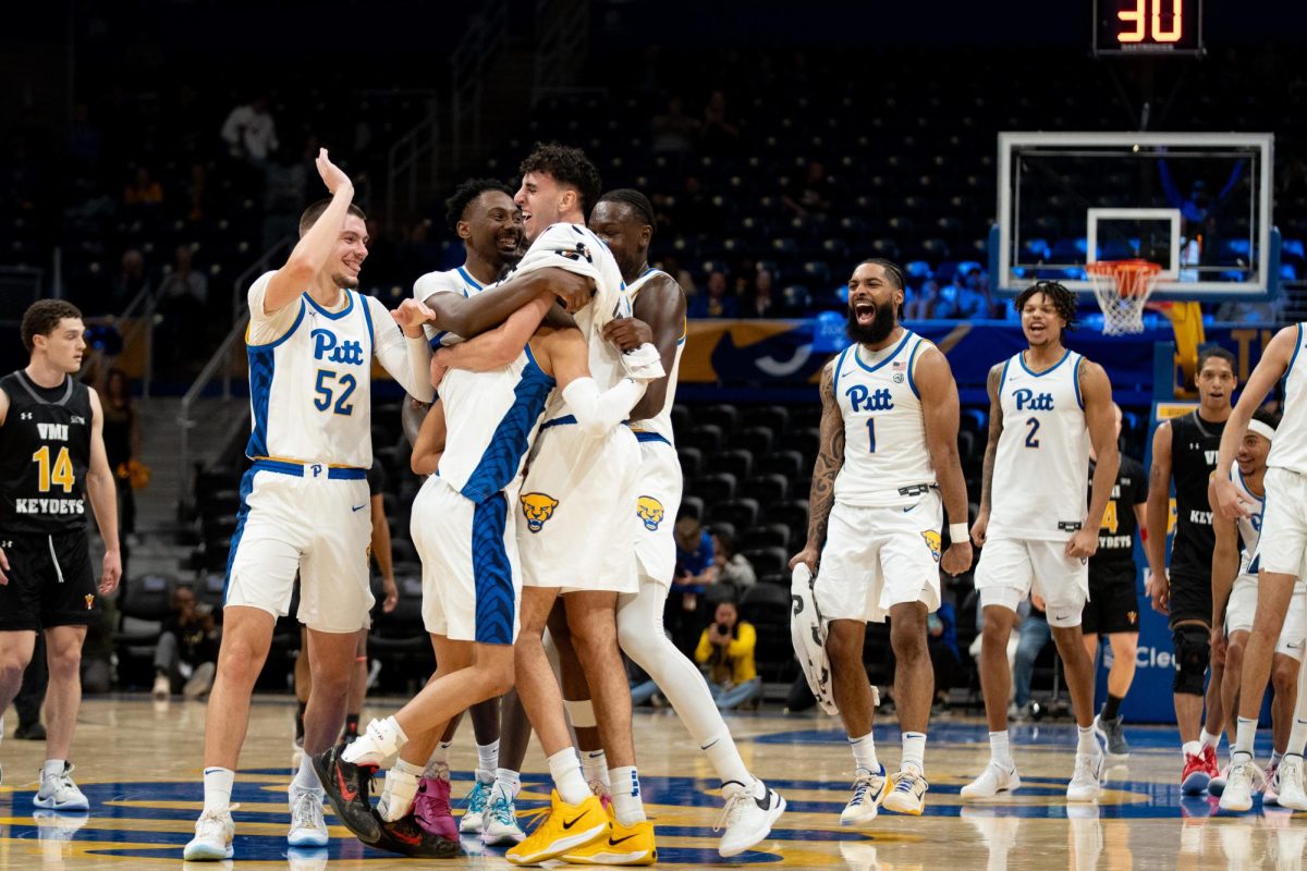 The Pitt men's basketball team celebrates during its game against VMI at the Petersen Events Center on Monday, Nov. 18.