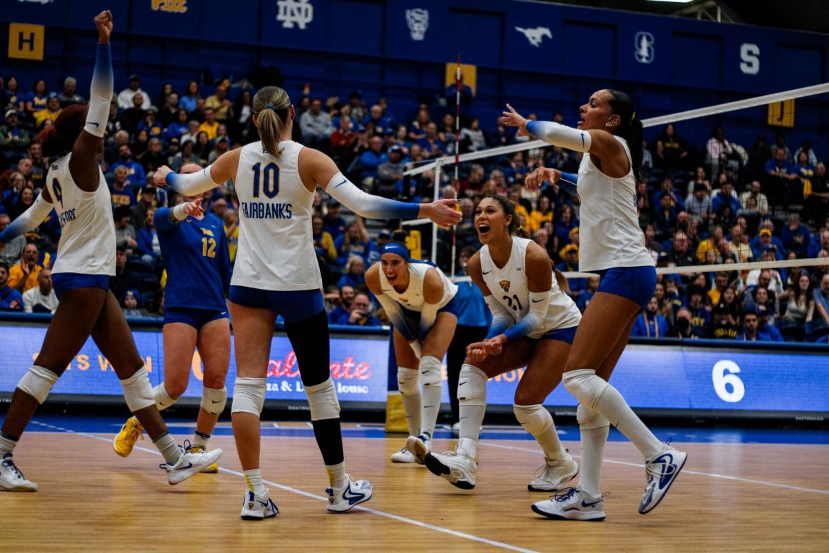 Pitt volleyball celebrates scoring a point against Florida State on Friday, Nov. 16.