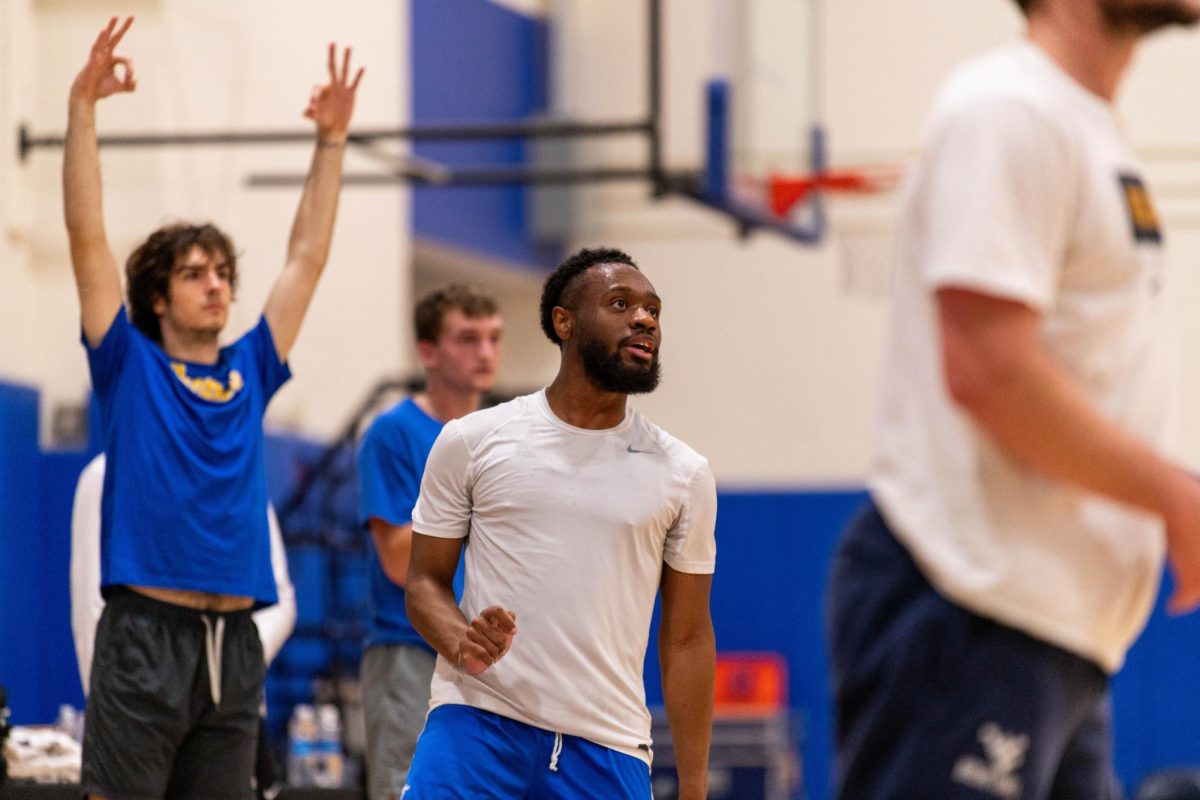 Pitt manager KJ Marshall watches his shot during the Pitt manager’s game against the West Virginia managers on Thursday, Nov. 14, 2024 on the  Pitt basketball practice court.