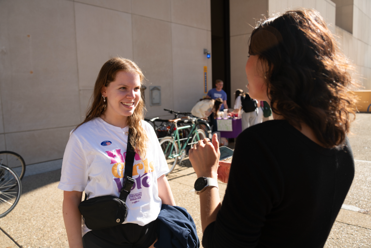 Sophia Bellinghausen, a junior communication science student, answers questions outside Posvar Hall after voting on Tuesday, Nov. 5.