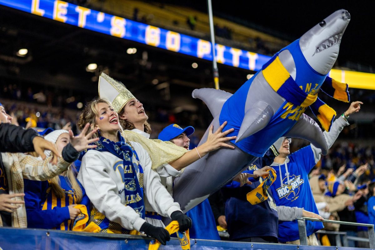 Ian Labatch, dressed in a pope costume, holds an inflatable shark at the Pitt football game against Syracuse in Acrisure Stadium on Thursday, Oct. 24.
Ian Labatch, dressed in a pope costume, holds an inflatable shark at the Pitt football game against Syracuse in Acrisure Stadium on Thursday, Oct. 24.
