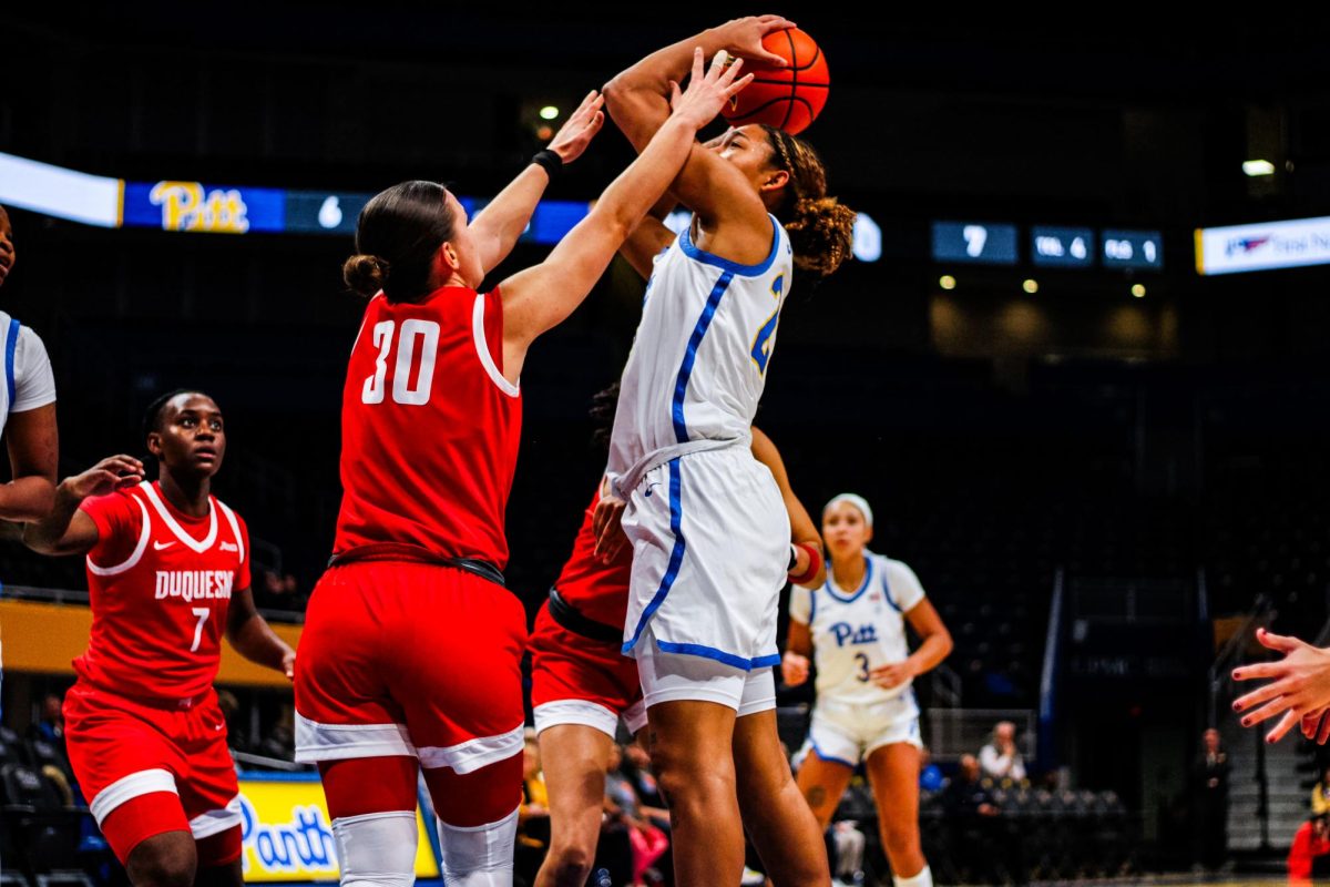 Redshirt sophomore guard Mikayla Johnson (23) shoots the basketball during Pitt women’s basketball’s game against Duquesne on Dec. 4, 2024 at the Petersen Events Center.