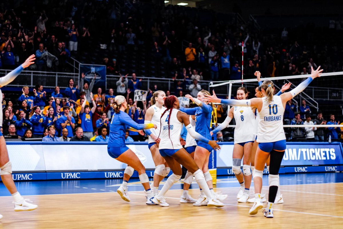 Pitt volleyball celebrates their victory in the first round of the NCAA tournament on Friday Dec. 6, 2024 at the Petersen Events Center.