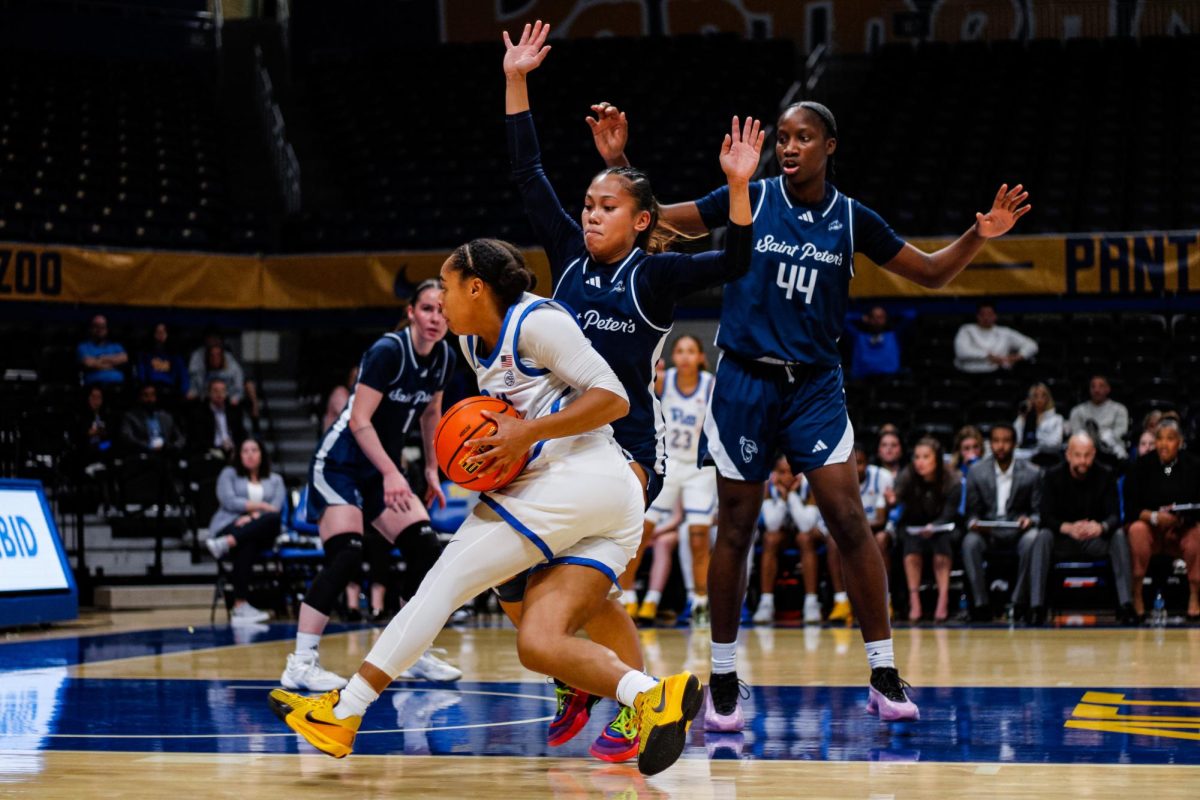 A Pitt women’s basketball player drives the basketball during Pitt women’s basketball’s game against St. Peters at the Petersen Events Center on Monday, Dec. 9, 2024.