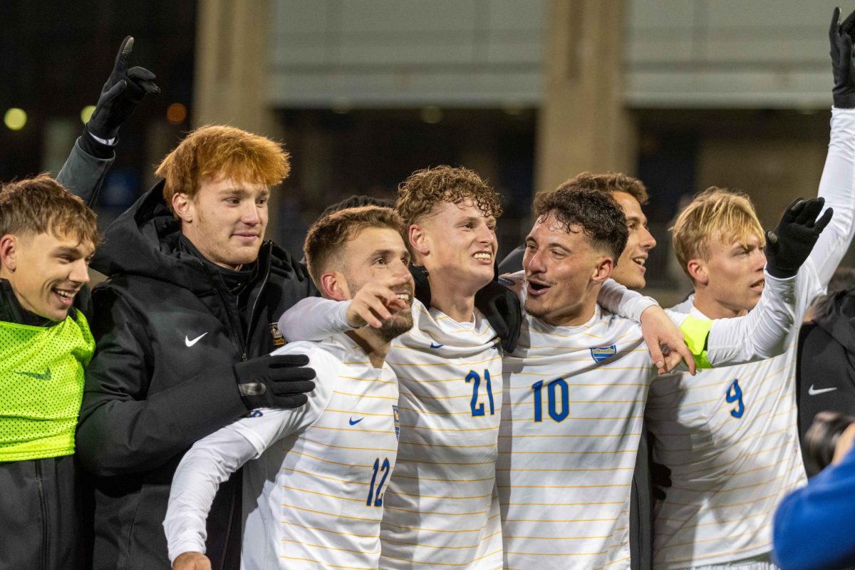 Pitt men’s soccer wave to the crowd following their win against Cornell at Ambrose Urbanic Field on Sunday, Nov. 24.
