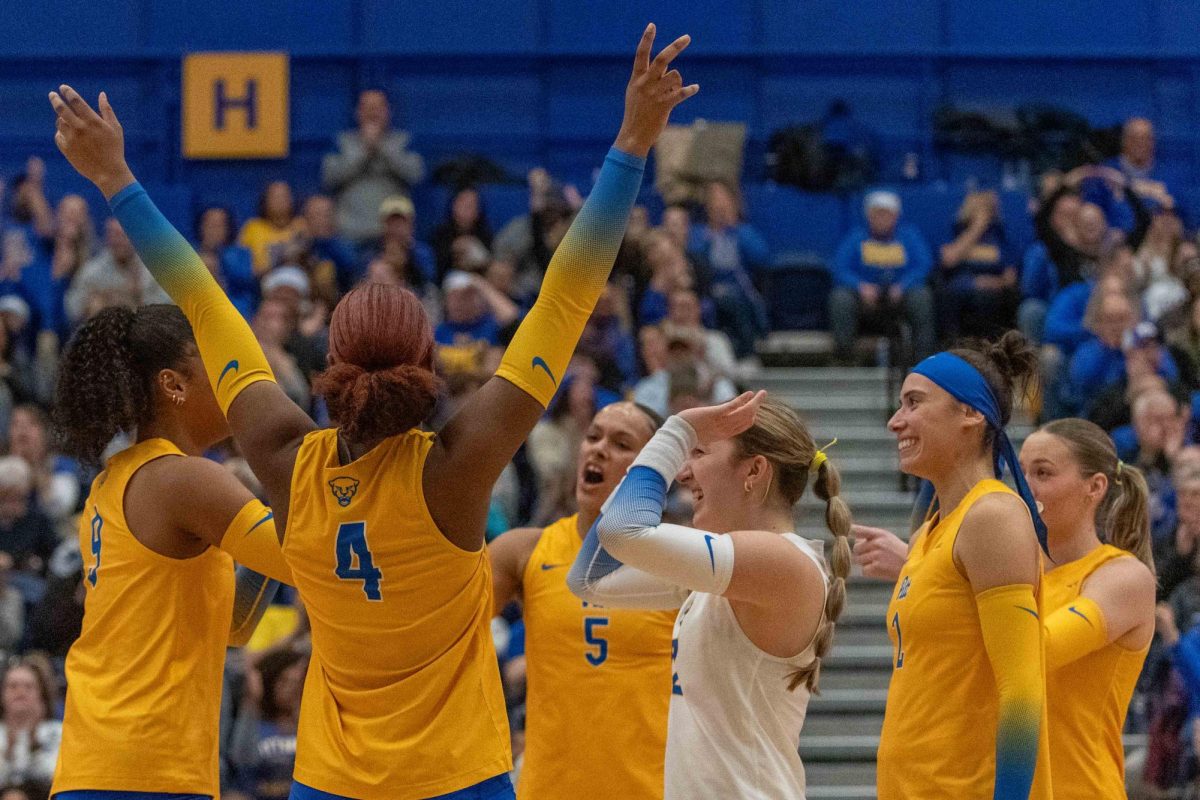 Pitt volleyball celebrates winning a set during the volleyball game against Georgia Tech in the Fitzgerald Field House on Saturday, Nov. 30.
