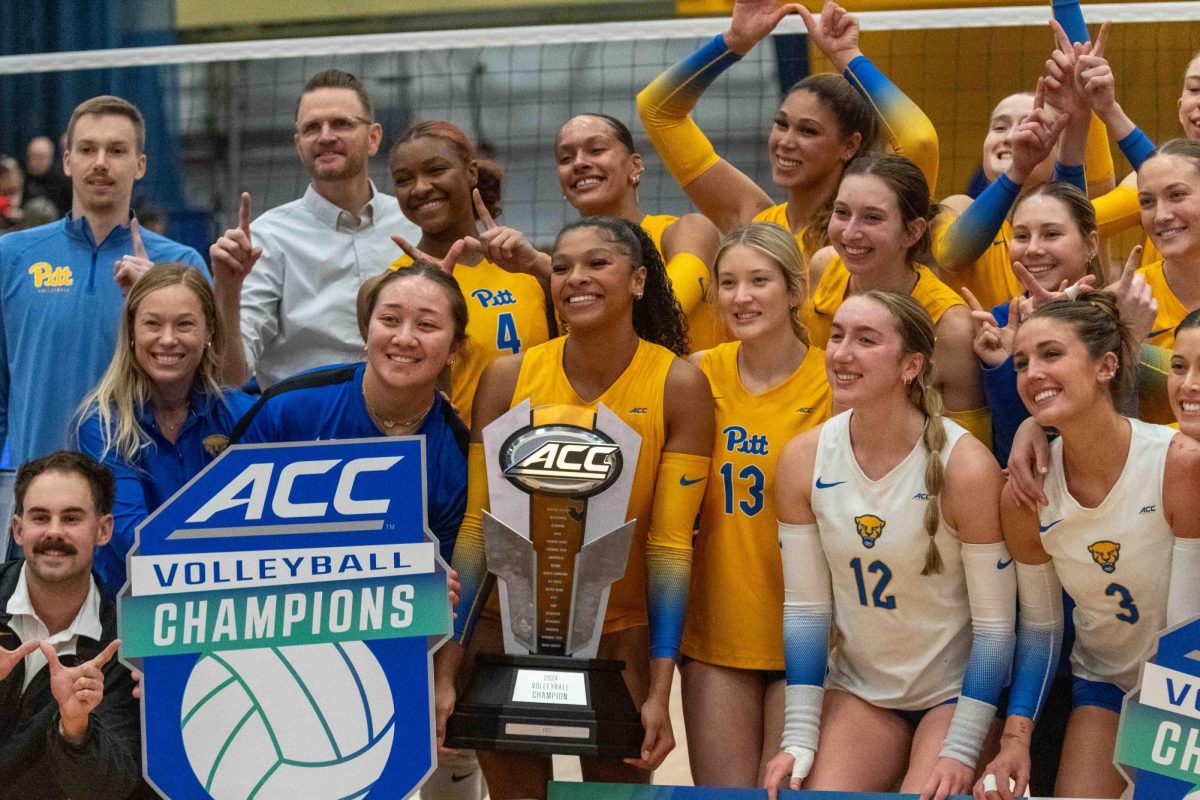 Pitt volleyball poses with the ACC Championship trophy following their win against Georgia Tech in the Fitzgerald Field House on Saturday, Nov. 30.