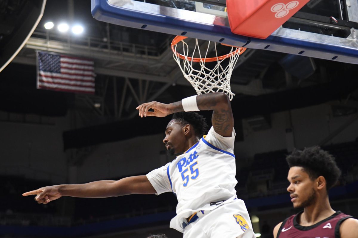 Redshirt senior guard Zack Austin (55) points to a teammate during Pitt men’s basketball’s game against EKU at the Petersen Events Center on Wednesday, Dec. 11, 2024.