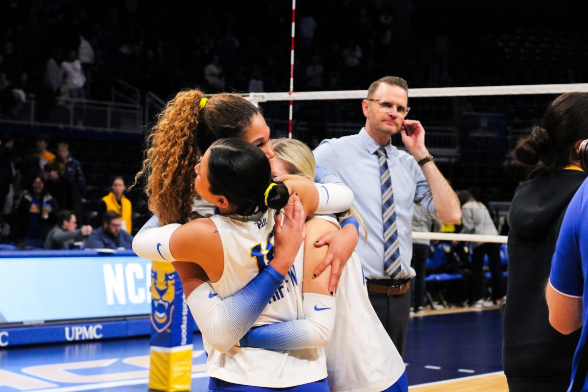 Pitt volleyball players embrace following the second round of the NCAA tournament on Saturday Dec. 7th, 2024 at the Petersen Events Center.