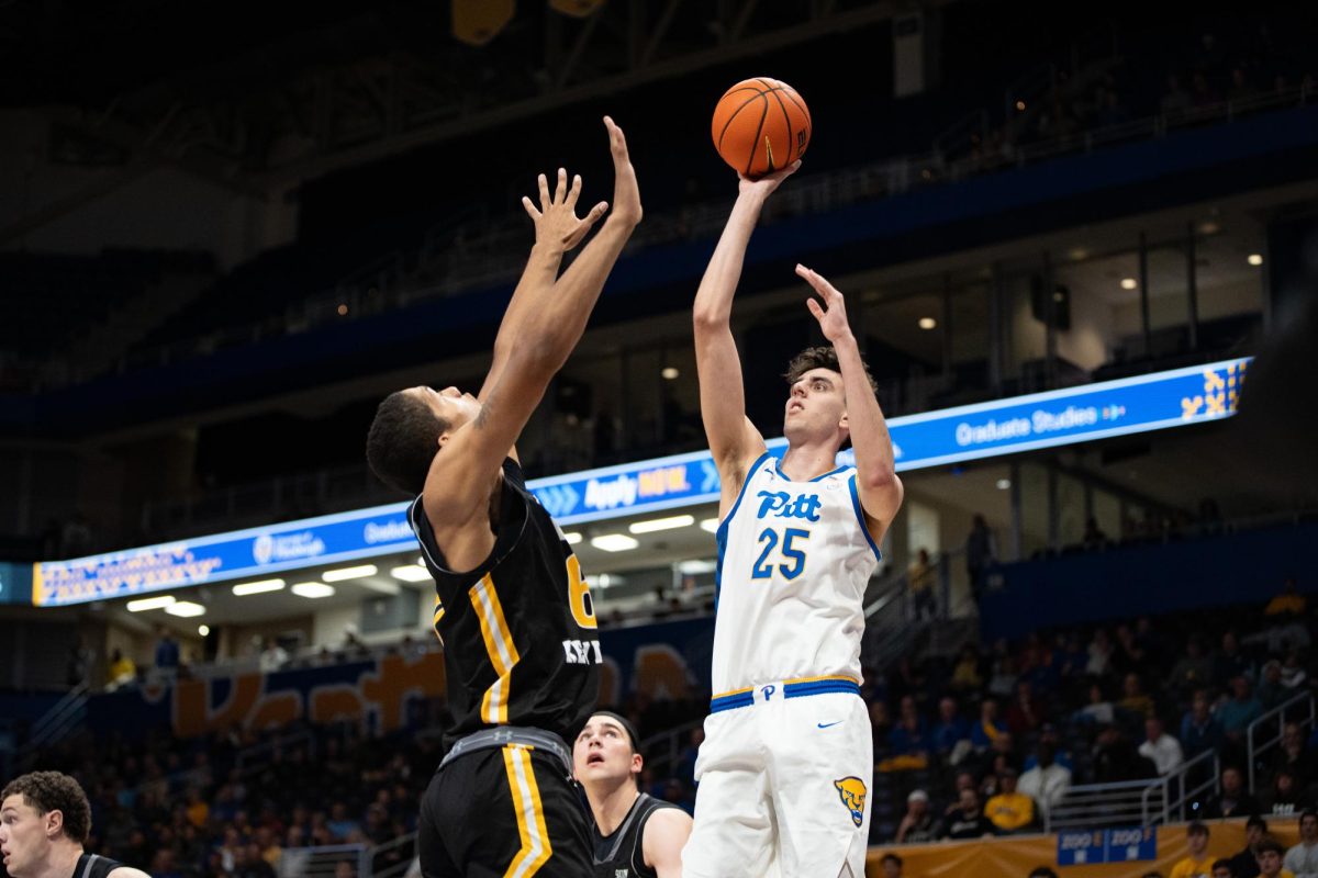 Junior forward Guillermo Diaz Graham (15) shoots the ball during Pitt men’s basketball’s game against VMI at the Petersen Events Center on Monday, Nov. 18.
