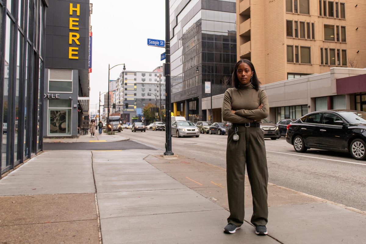 Nala Gallaher poses for a photo outside the HERE apartment complex.