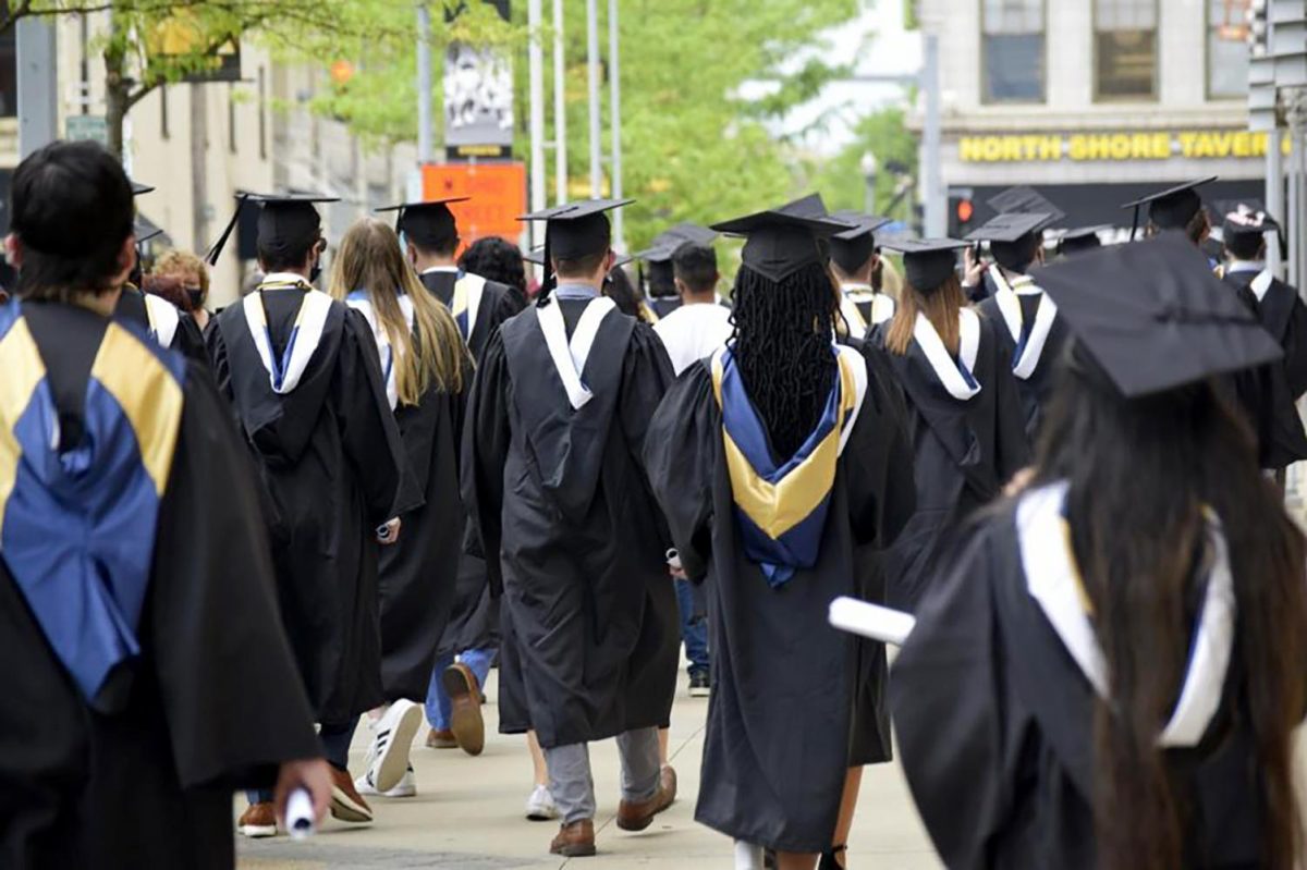 Pitt graduates after 2021 commencement at Acrisure Stadium.