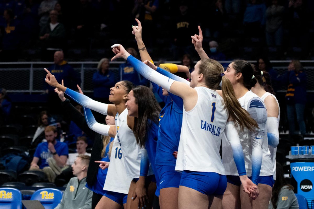 Pitt Volleyball players indicate that it is set point during the third round of the NCAA tournament on Thursday Dec. 12, 2024 at the Petersen Events Center.