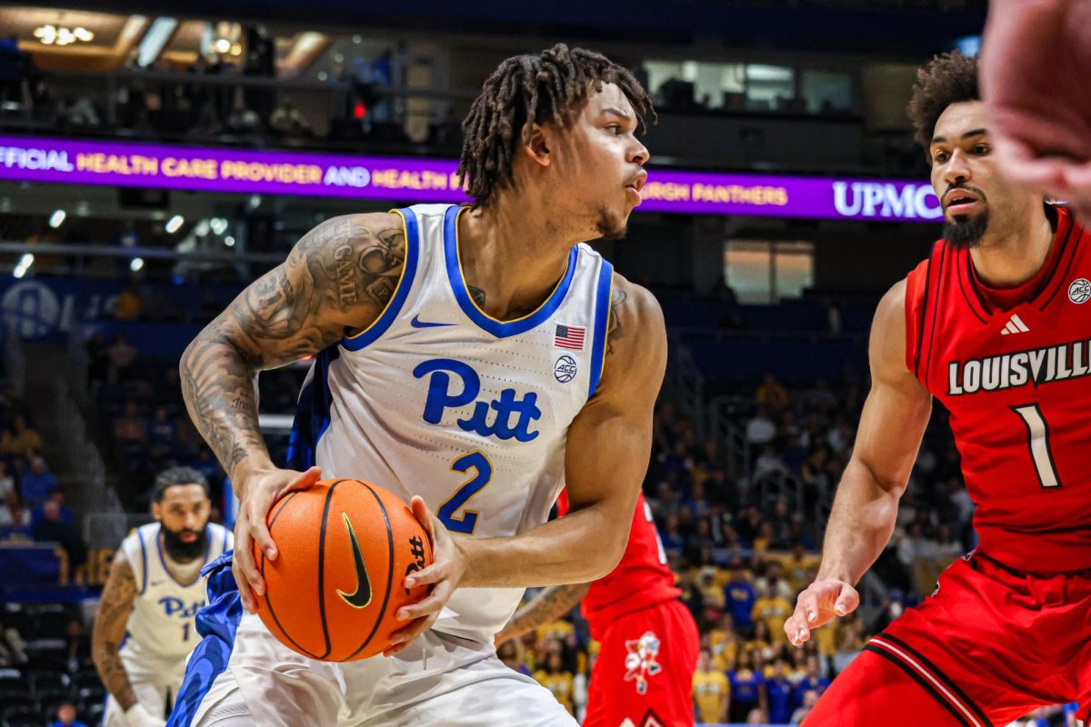 Junior forward Cameron Corhen (2) prepares to pass the ball during the men’s basketball game against Louisville in the Petersen Events Center on Saturday, Jan. 11. 
