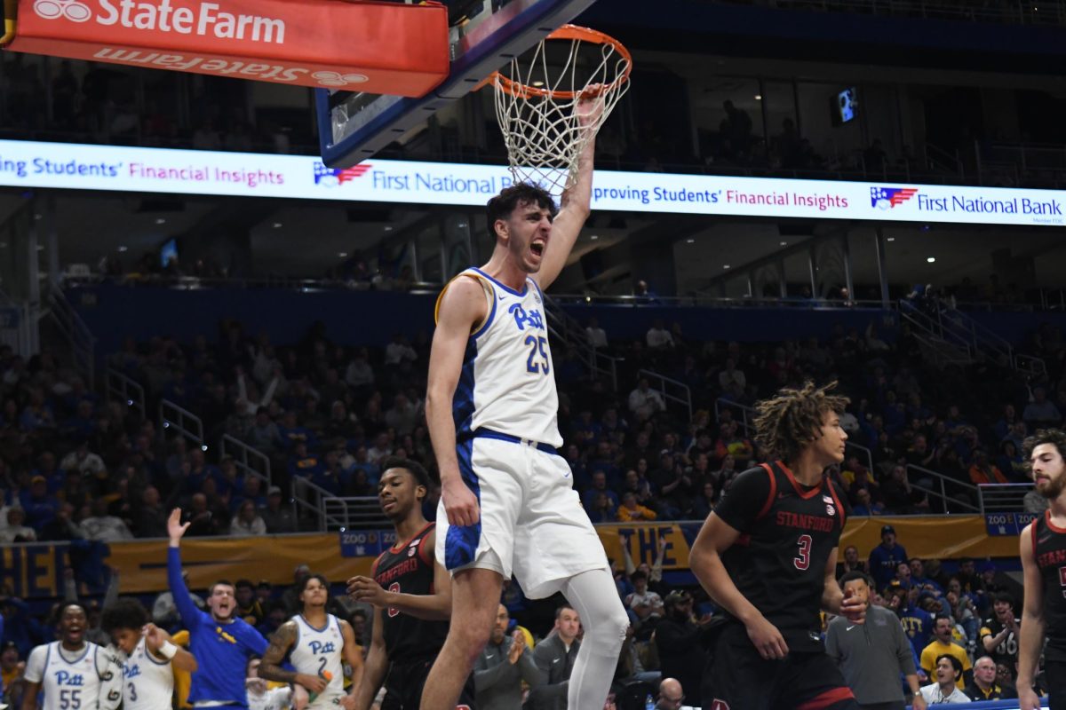 Junior forward Gulliermo Diaz-Graham (25) celebrates after a dunk during Pitt men’s basketball’s game against Stanford at the Petersen Events Center on Saturday, Jan. 5.