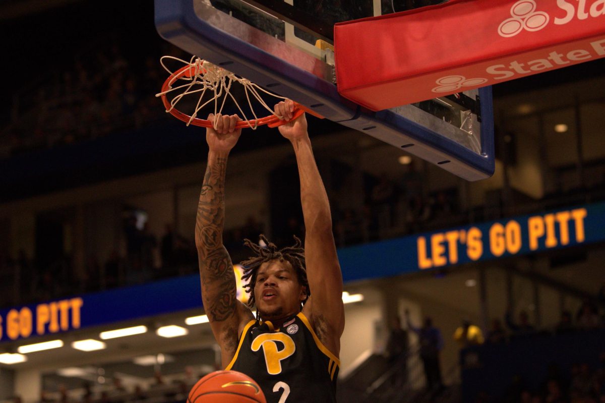 Junior forward Cameron Corhen dunks a basketball against North Carolina on Tuesday, Jan. 28