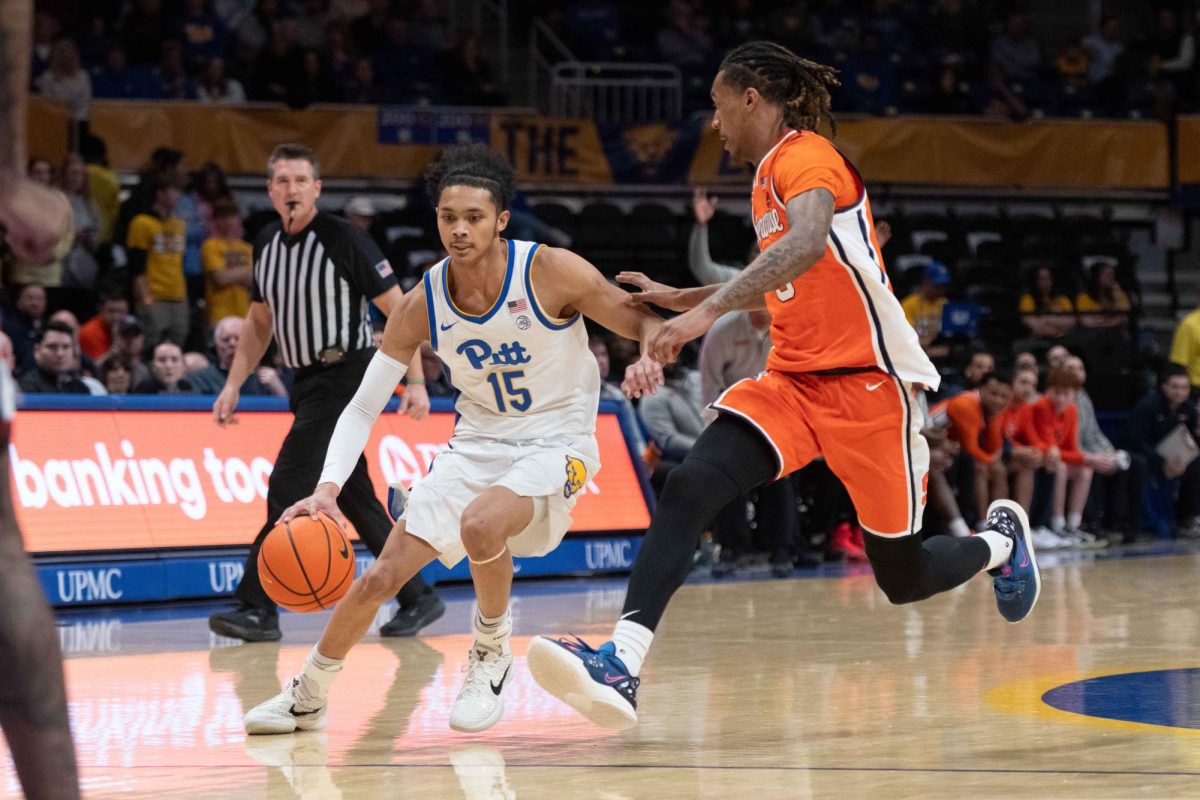 Sophomore guard Jaland Lowe dribbles the ball around a Syracuse defender on Tuesday, Feb. 18.