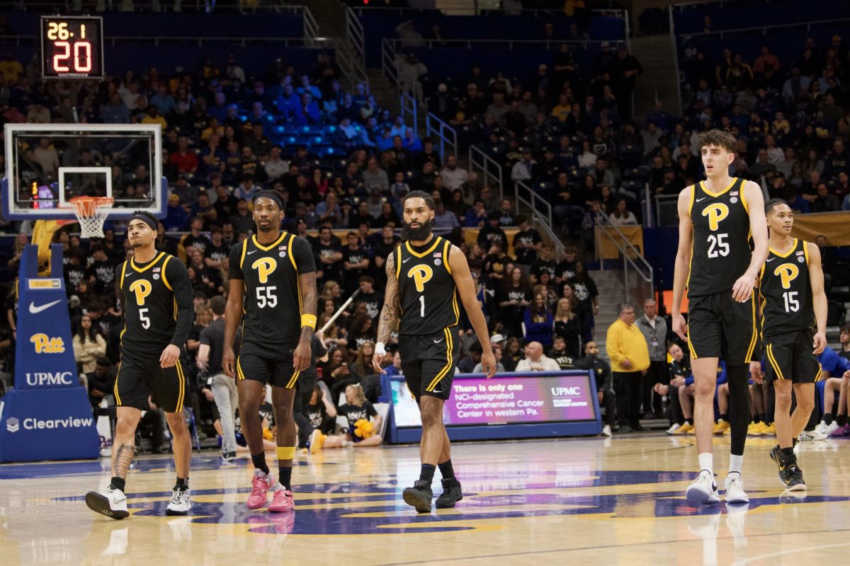 Pitt men’s basketball walk on the court during the game against UNC in the Petersen Events Center on Tuesday, Jan. 28.