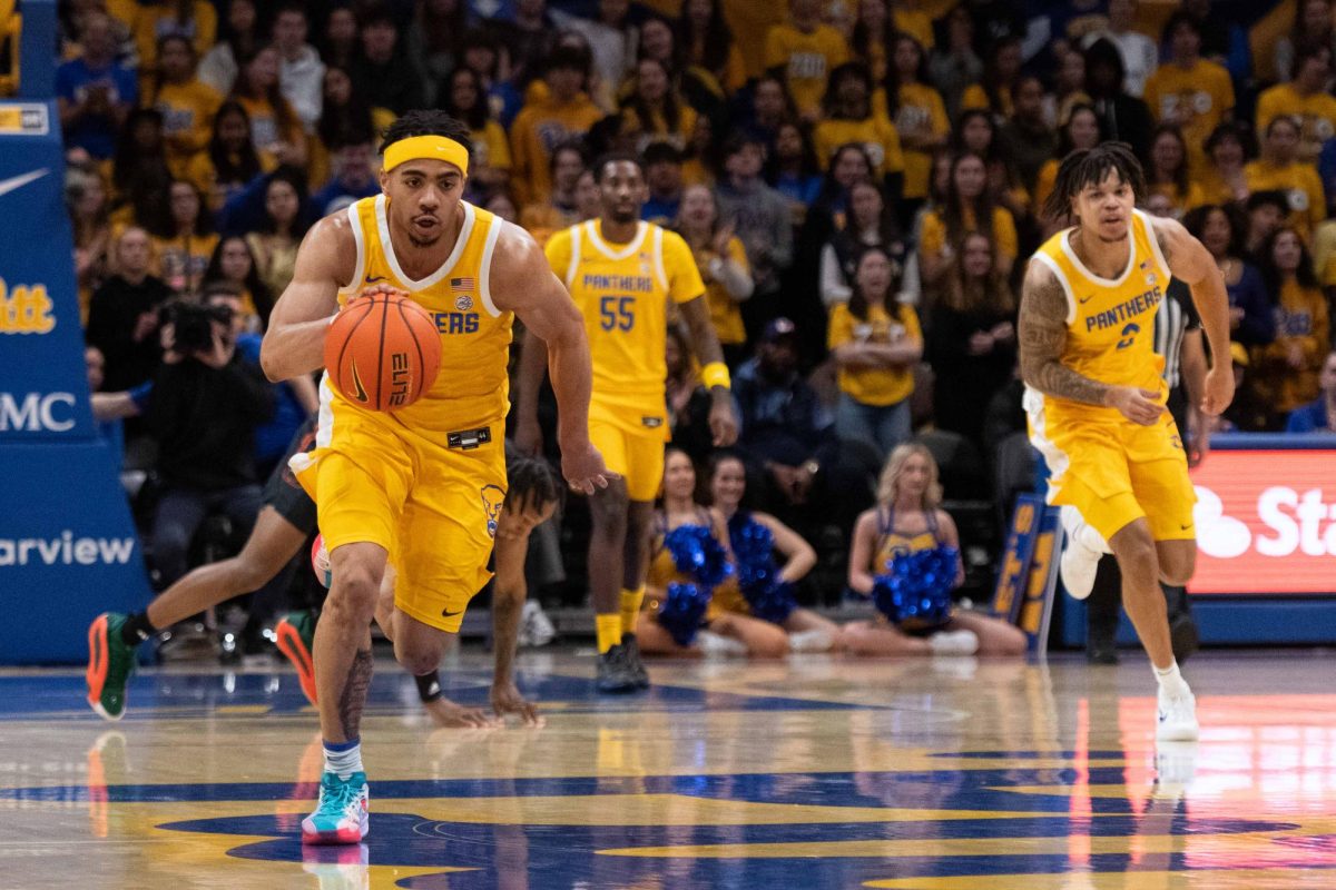 Senior guard Ishmael Leggett (5) drives the ball down the court during the Pitt men’s basketball game against Miami in the Petersen Events Center on Saturday, Feb. 15.
