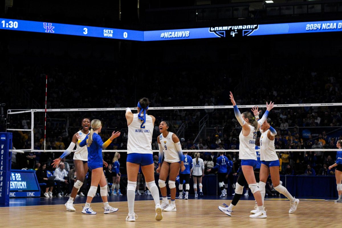 Pitt volleyball players celebrate a point during the quarterfinals of the NCAA tournament on Saturday, Dec. 14, 2024 at the Petersen Events Center.
