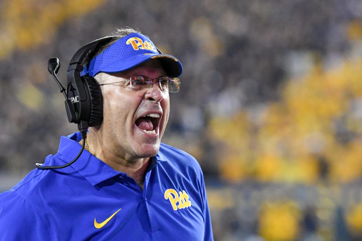 Head coach Pat Narduzzi yells at players during the Backyard Brawl in Morgantown, West Virginia, on Saturday, Sept. 16, 2023.
