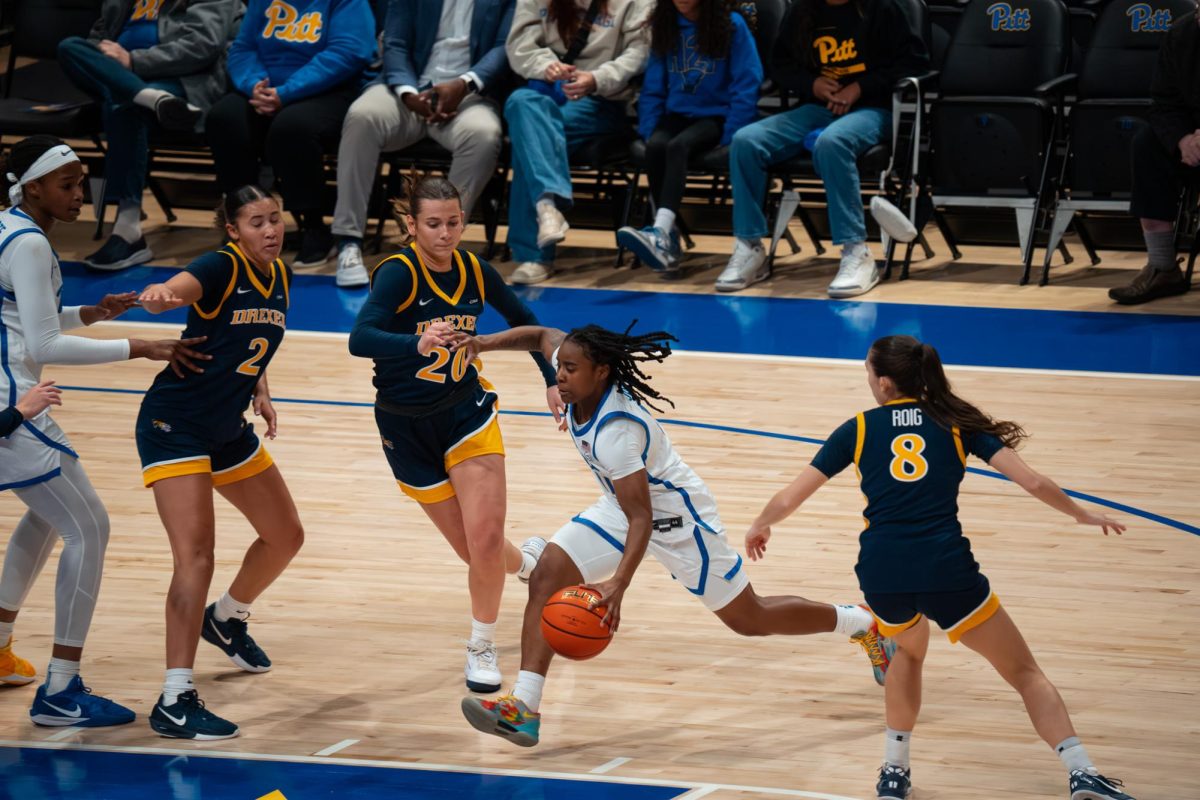 Senior guard Angel Jones (11) drives the ball during a game against Drexel at the Petersen Events Center on Nov. 4, 2025.
