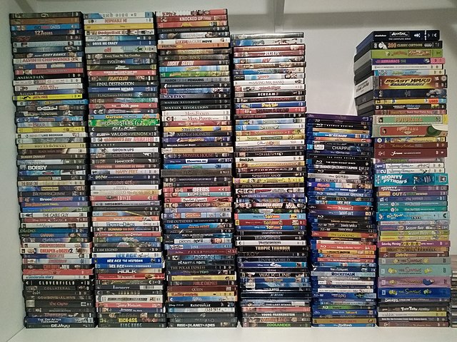 A stack of DVDs and Blu-ray videos.