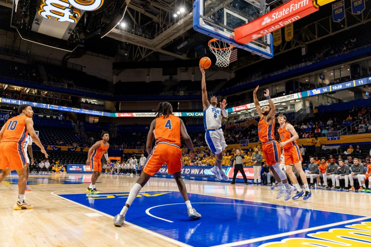 First-year guard Omari Witherspoon (8) shoots the ball during a Pitt men's basketball game against Bucknell at the Petersen Events Center on Nov. 17, 2025.
