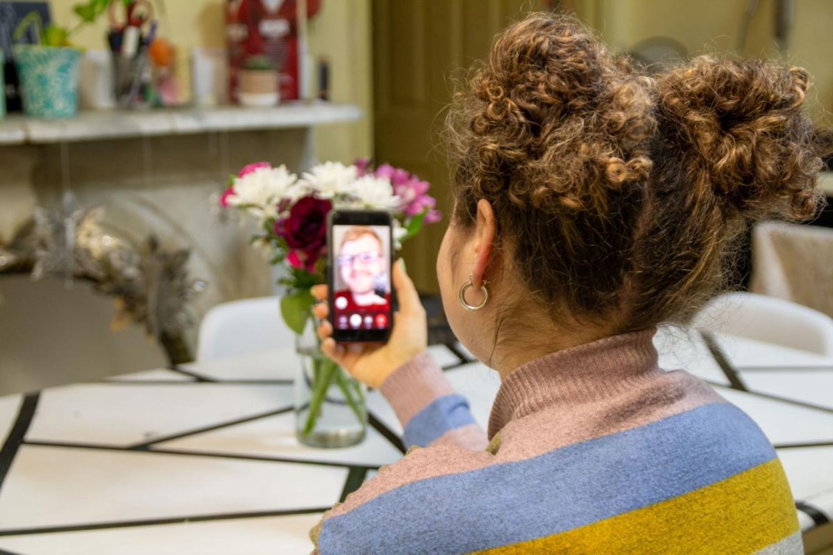 A student speaks on a video call.