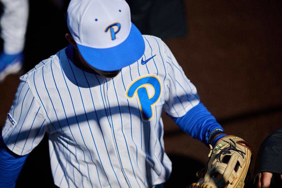 A Pitt baseball player enters the dugout during Pitt baseball’s game against UVA at Cost Field on March 23, 2024.
