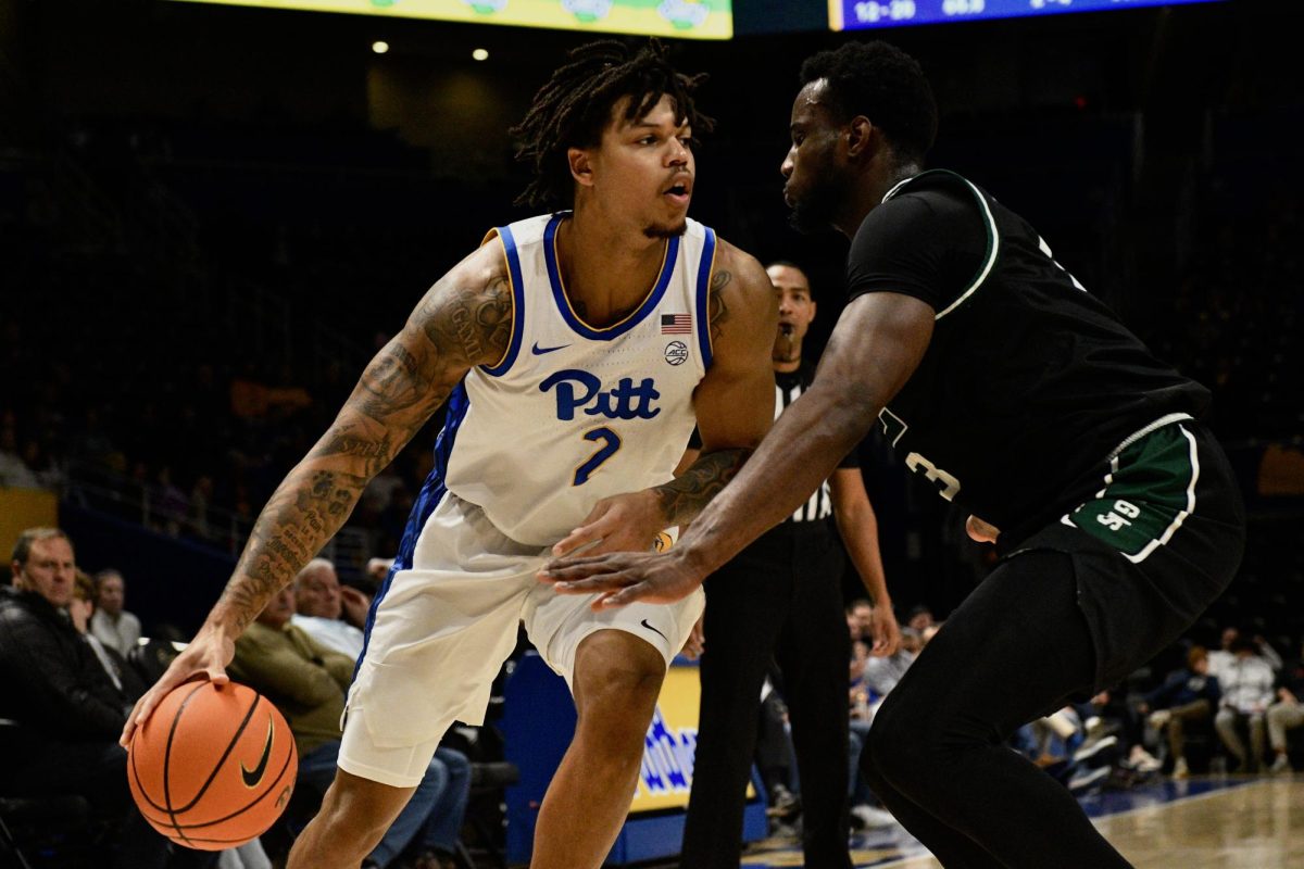 Senior forward Cameron Corhen (2) dribbles the ball during a Pitt men’s basketball’s game against Eastern Michigan at the Petersen Events Center on Nov. 10, 2025.
