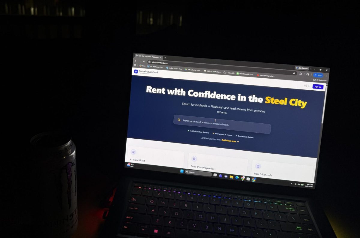 A laptop with the Rate Yinz Landlord website on the screen. 
