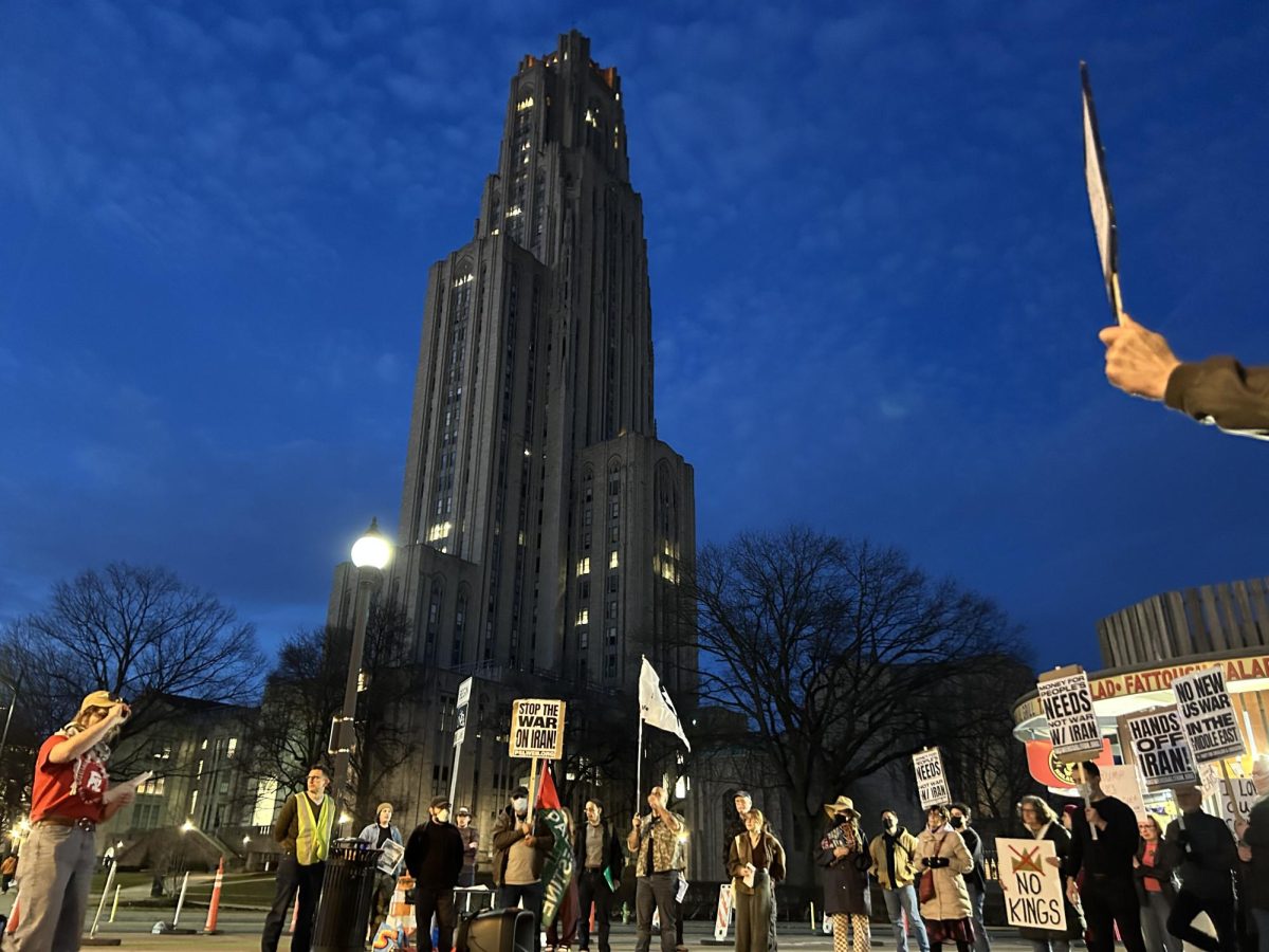 Protesters congregate in Schenley Plaza on Saturday to protest the recent military strikes on Iran.