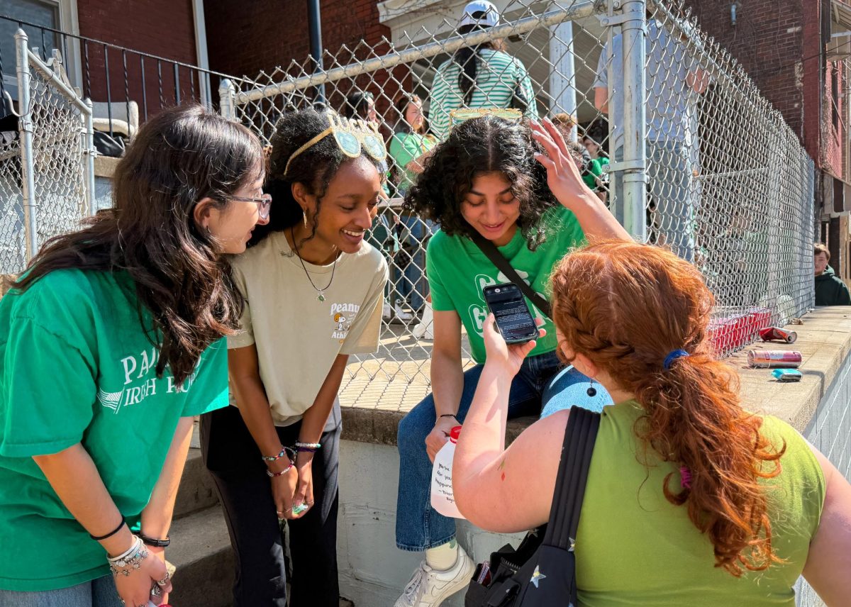 Senior staff writer Maxine Van Nortwick interviews students at the Ginger Run on Semple Street in Oakland, Pennsylvania. 
